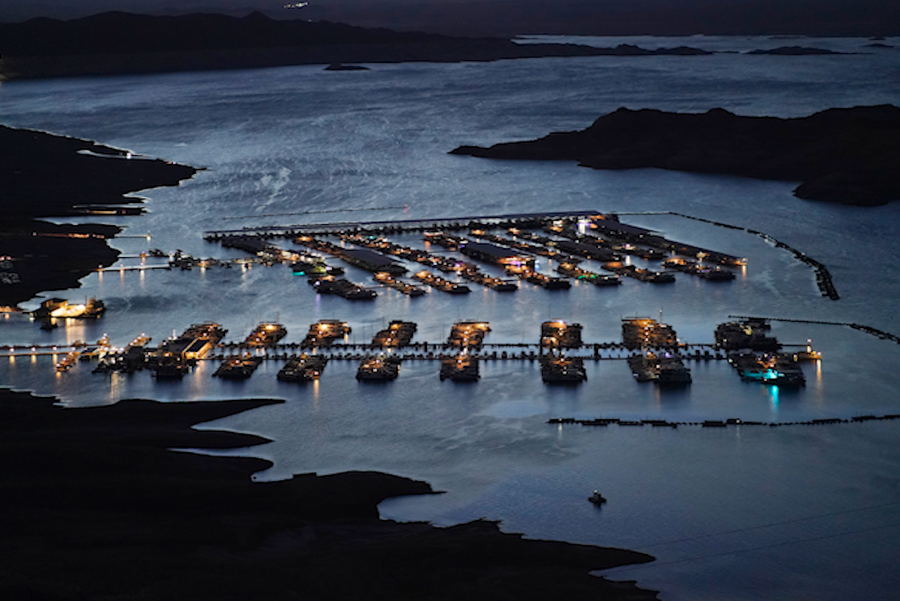 Lights illuminate boat docks at Hemenway Harbor on Lake Mead at the Lake Mead National Recreation Area, Monday, July 4, 2022, near Boulder City, Nev.
