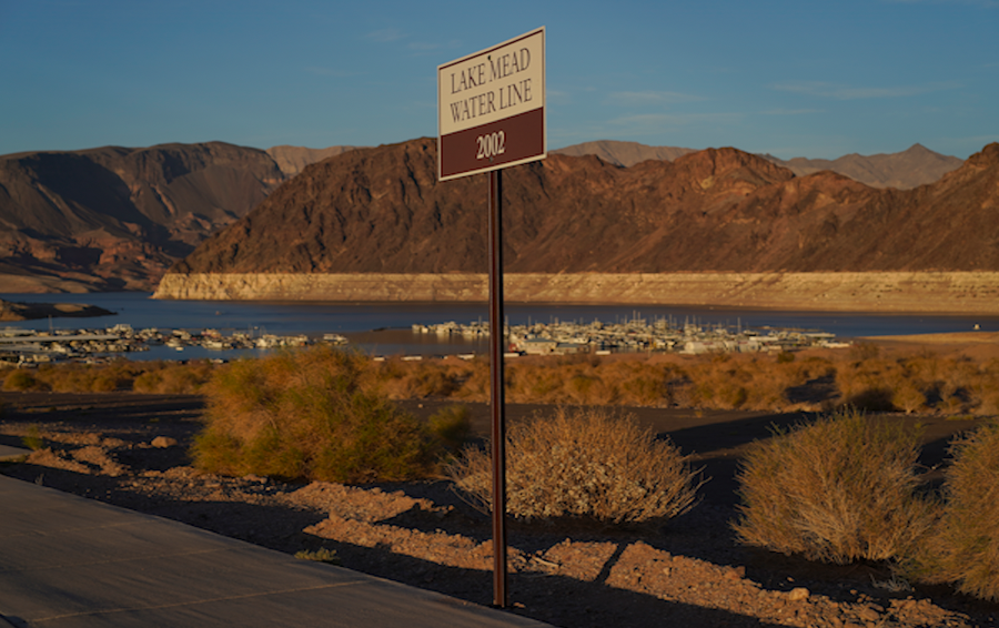 A sign marks the water line from 2002 near Lake Mead at the Lake Mead National Recreation Area, Saturday, July 9, 2022, near Boulder City, Nev. The largest U.S. reservoir has shrunken to a record low amid a punishing drought and the demands of 40 million people in seven states who are sucking the Colorado River dry.